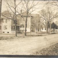 Main Street Scene:  Town Hall, Normal and Industrial School, and House at 185 S. Main St. (1910 Postcard to Edgar Snow)