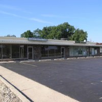 Cross Street Strip Mall:  Family Dental; Country Insurance; Genoa Pizza